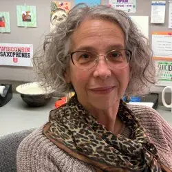 Sharon R. Stoffel, MS, LCSW, LPC, a mental health professional with over 40 years of experience in counseling, assessment, and grief support, seated at her office desk at the Fond du Lac Area YScreen Program.